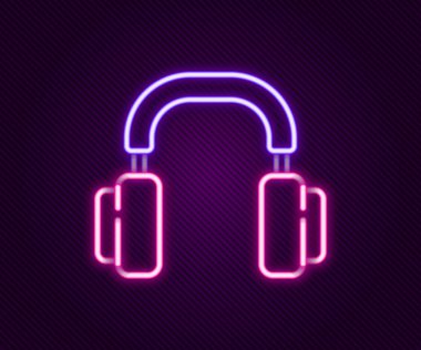 Parlayan neon hattı kulaklık simgesi siyah arkaplanda izole edildi. Kulaklıklar. Müzik, hizmet, iletişim ve operatör konsepti. Renkli taslak konsepti. Vektör