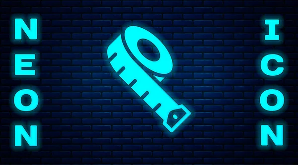 Glowing neon Measuring tape icon isolated on brick wall background. Tape measure. Vector — Stockvector