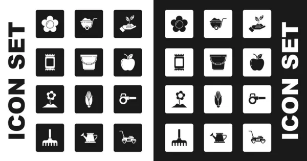 Set Pflanze in der Hand von Umwelt, Eimer, Düngerbeutel, Blume, Apfel, Schubkarre mit Schmutz, Laubbläser und Symbol. Vektor — Stockvektor