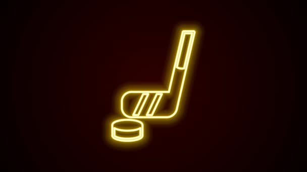 Glödande neon linje Ishockeyklubba och puck ikon isolerad på svart bakgrund. 4K Video motion grafisk animation — Stockvideo