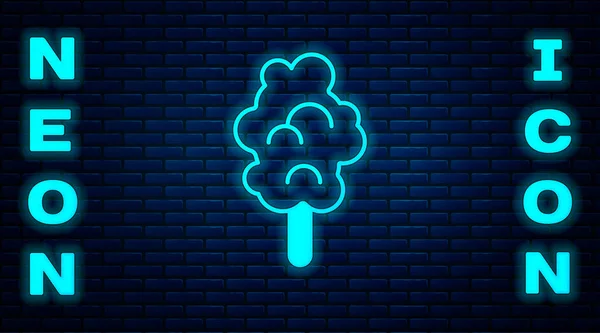Glödande neon Bomull godis ikon isolerad på tegel vägg bakgrund. Vektor — Stock vektor