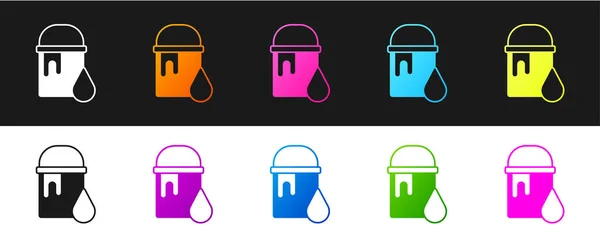 Set Icono de cubo de pintura aislado sobre fondo blanco y negro. Vector — Vector de stock