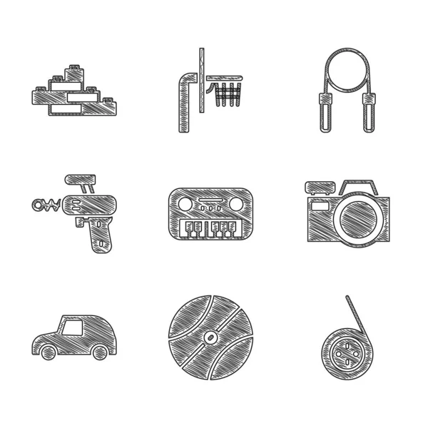 Set Toy piano, Basketball ball, Yoyo toy, Photo camera, car, Ray gun, Jump rope and building block bricks icon. Vector — Stock Vector