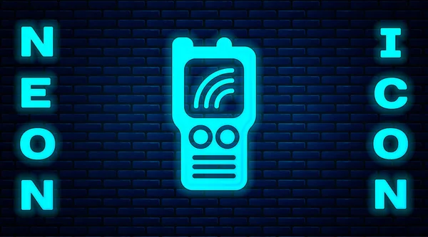 Glowing neon Walkie talkie icon isolated on brick wall background. Portable radio transmitter icon. Radio transceiver sign. Vector — Stock Vector