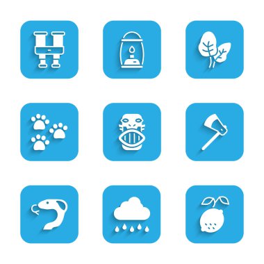 Meksika mayası ya da aztek maskesi yağmurlu bulut, limon, tahta balta, yılan, pençe izi, tropikal yapraklar ve dürbün simgesi. Vektör