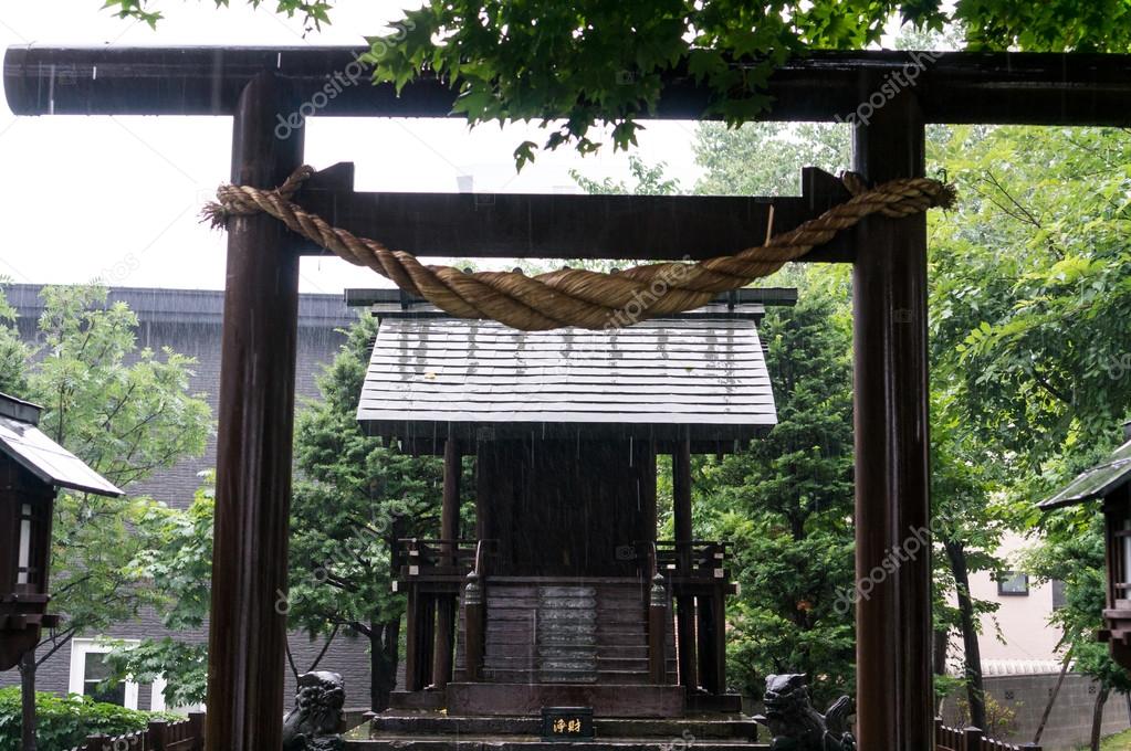 Japanese shrine under rain
