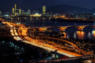 Night traffic over han river in seoul clipart