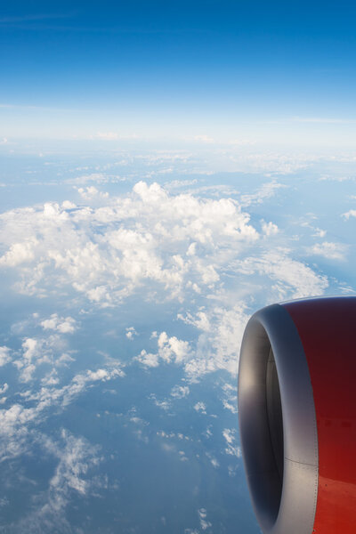 View from the airplane window to see sky on day time.