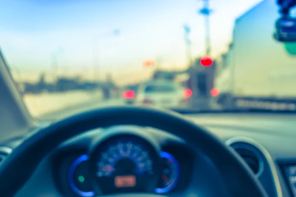 Blur image of inside car with bokeh on day time for background u — Stock Photo, Image