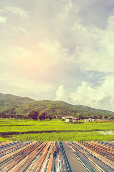 Wood table and image of green mountain . — 스톡 사진