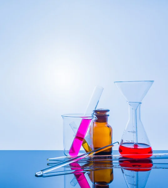 Glassware with blur laboratory in background. — Stock Photo, Image