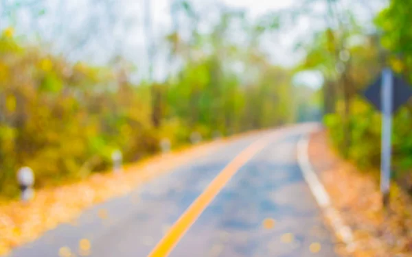 背景使用日时间抽象模糊道路图像 — 图库照片