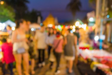 Arka plan kullanımı için Bokeh ile gece pazarının soyut bulanık görüntüsü .