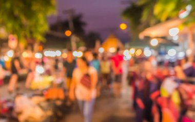 Arka plan kullanımı için Bokeh ile gece pazarının soyut bulanık görüntüsü .