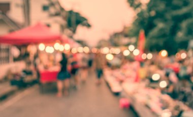 Arka plan kullanımı için Bokeh ile gece pazarının klasik ton bulanık görüntüsü .