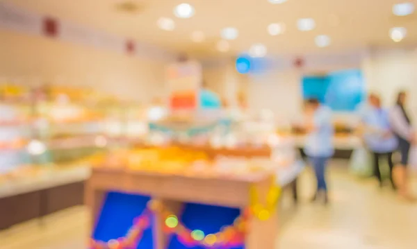 image of blur people shopping at bakery shop for background usage .