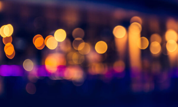 Image of blurred bokeh background with warm colorful lights. (vintage tone)