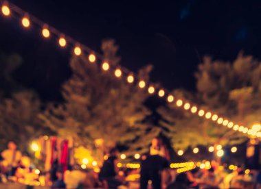 Arka plan kullanımı için Bokeh ile bahçede gece festivalinin klasik ton bulanık görüntüsü .