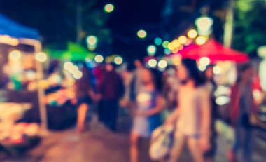 Arka plan kullanımı için Bokeh ile gece pazarının klasik ton bulanık görüntüsü .