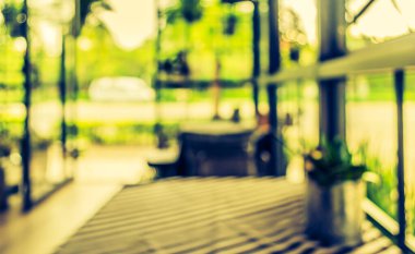 Kafenin arka planında Bokeh imajı var. (Klasik ton))