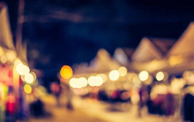 Arka plan kullanımı için Bokeh ile sokakta bulanık gece pazarının klasik ton görüntüsü .