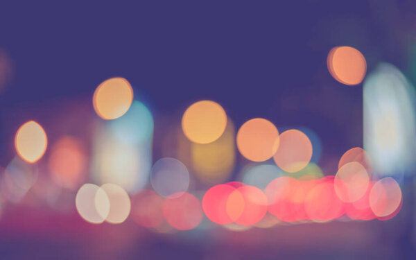 Abstract blurred Street Colurful bokeh on night time for background usage . (vintage tone)
