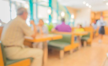 Arka plan kullanımı için Bokeh ile restoranın bulanık görüntüsü. (sıcak ton))