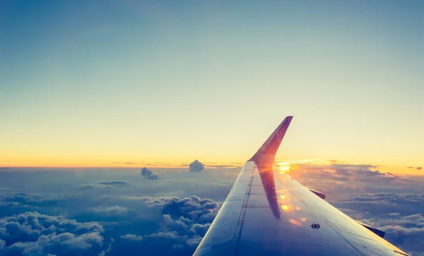 View from airplane window to see sky on evening time. (vintage tone)