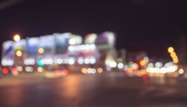Arka plan kullanımı için gece vakti renkli ışıkları olan bulanık sokak Bokeh 'inin klasik ton görüntüsü .
