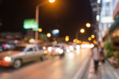 Arka plan kullanımı için gece vakti renkli ışıkları olan bulanık sokak Bokeh 'inin klasik ton görüntüsü .