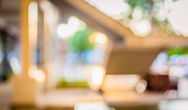 Arkaplan kullanımı için günbatımında modern binanın bulanık görüntüsü.