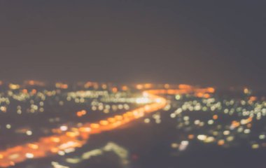 Soyut şehir bokeh ışık arkaplanının klasik ton bulanık görüntüsü