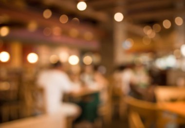 Bokeh imajı olan bir kafenin arka planı bulanık .