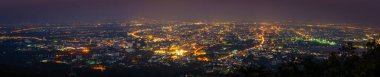 long exposure shot panorama image of Chiang Mai province,Thailand the old city  view from high angle spot night time.