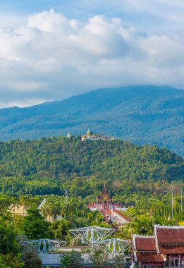 Old temple and holy Buddha statue on mountain at Wat Phra That Doi Kham temple, Chiang Mai , Thailand.(vertical)