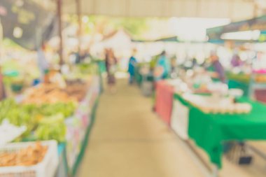 vintage tone image of blur thailand vegetable market with bokeh for background usage.