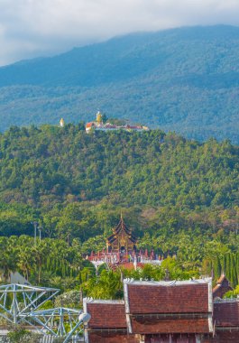 Old temple and holy Buddha statue on mountain at Wat Phra That Doi Kham temple, Chiang Mai , Thailand.(vertical)