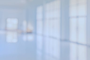 Abstract blur image of blue tone hospital office room for background usage .