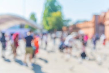 blur image of people on street close to 
