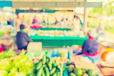 vintage tone image of blur thailand vegetable market with bokeh for background usage.