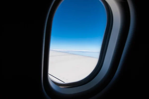 image of View from plane window to see the sky and wing for background.