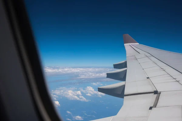 image of View from plane window to see the sky and wing for background.