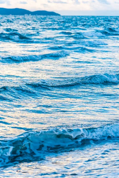 Vertical image of wave on sea shore for background.