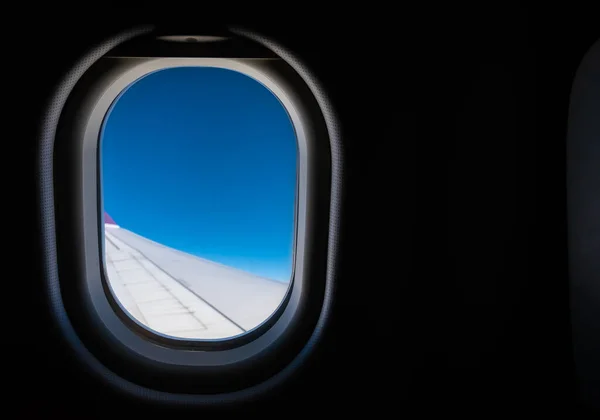 image of View from plane window to see the sky and wing for background.