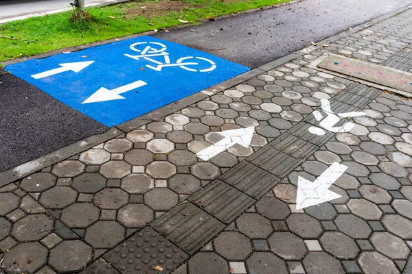 image of asphalt road and new  wa;k and bike lane with sign for background usage.