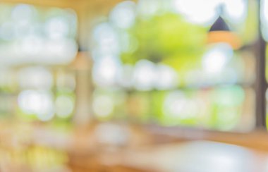 Gündüz vakti Bokeh 'in arka plan kullanımı için kullandığı kafenin ya da restoranın soyut bulanık görüntüsü. (Klasik ton))
