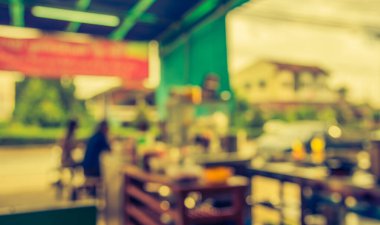 Arka plan kullanımı için Bokeh ile kahve dükkanının klasik ton bulanık görüntüsü .