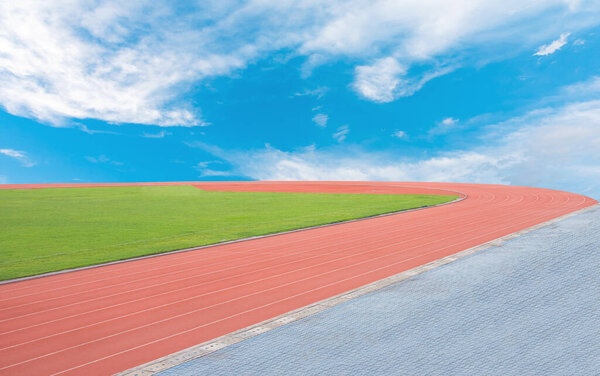 image of runners race track with blue sky on day time.