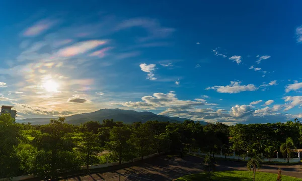 panorama image of rainbow color on blue sky and mountain in background at Doi Suthep Chiang Mai,Thailand.