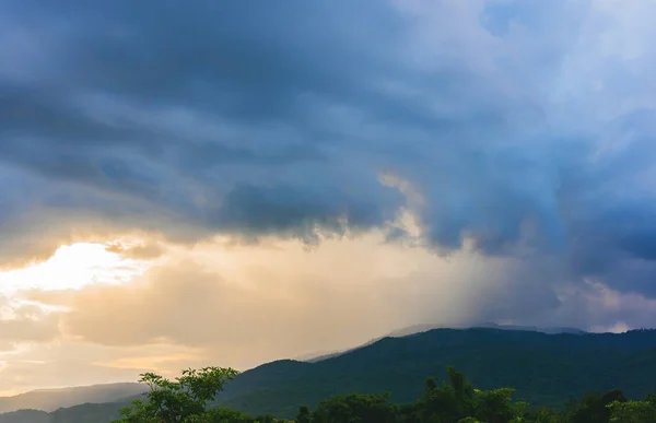 image of rain on mountain with sunshine in background at Doi Suthep Chiang Mai,Thailand.